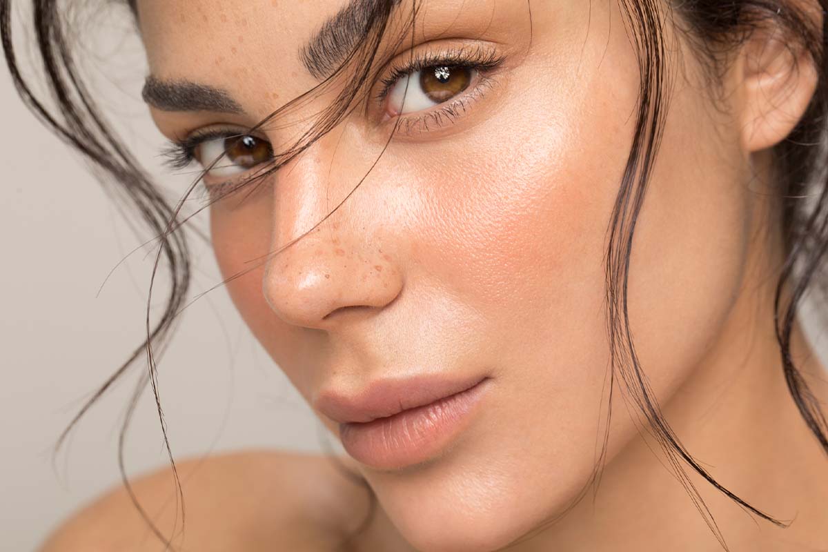 Close-up of glowing, even-toned skin after melasma treatment in Westchase.